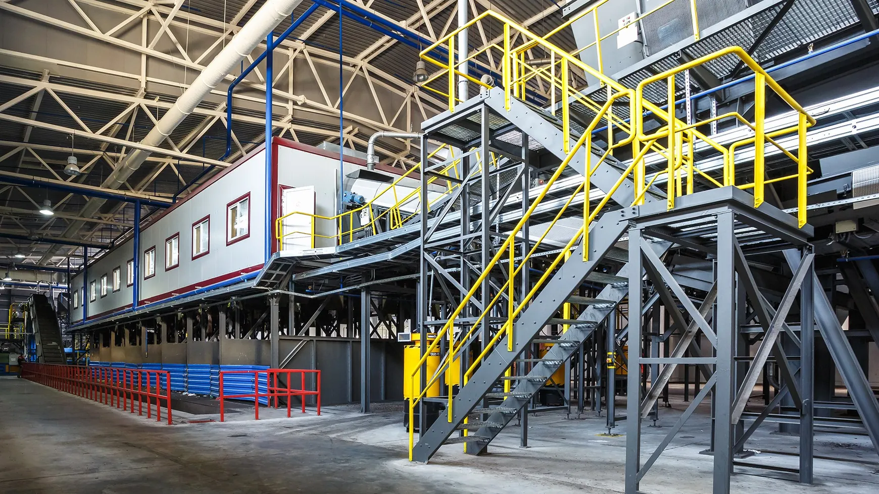 Large factory mezzanine with access stair and elevated steel platform