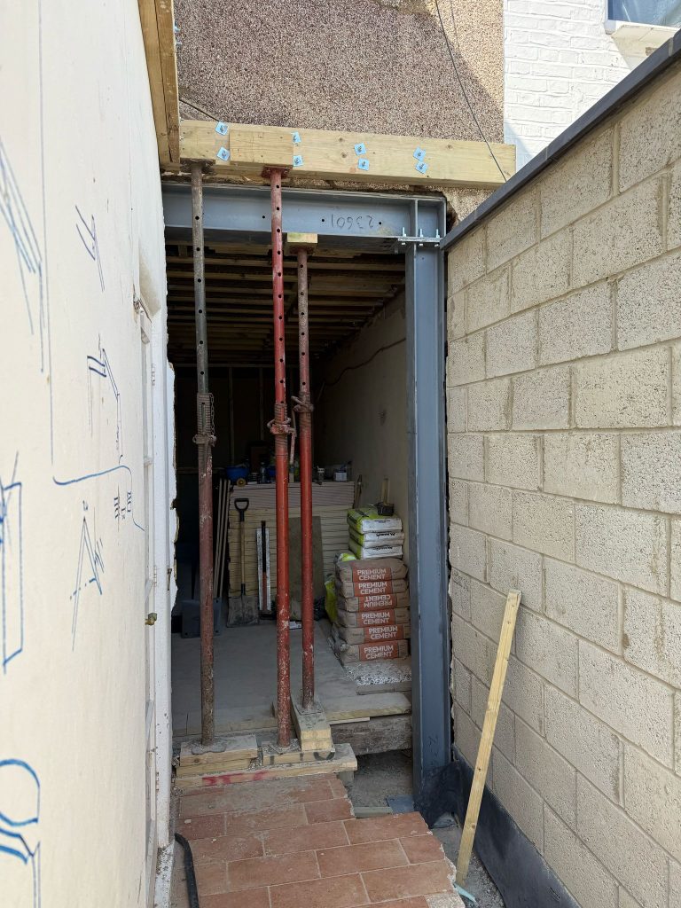 steel cutting, steel stock, fabrication bay, welding steel, drilled plates, end plates, steel priming, sandblasted steel, steel transport, steel fixings, site delivery, structural frame